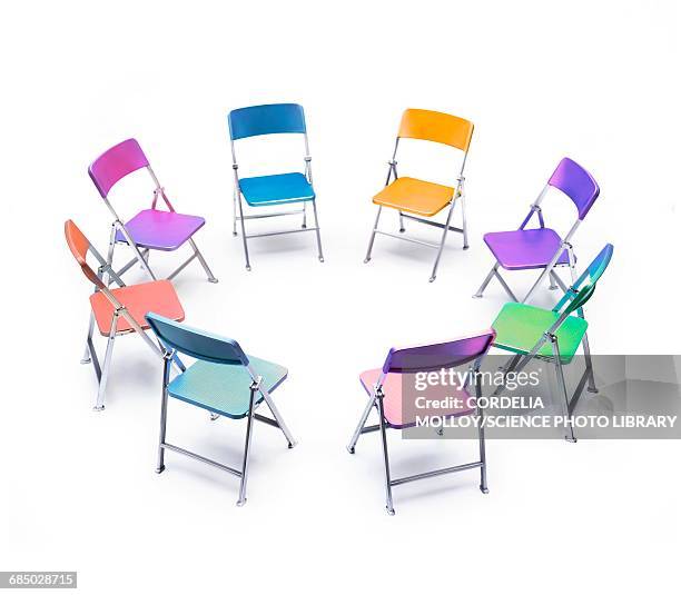 circle of chairs of different colours - conversation abstract stock illustrations