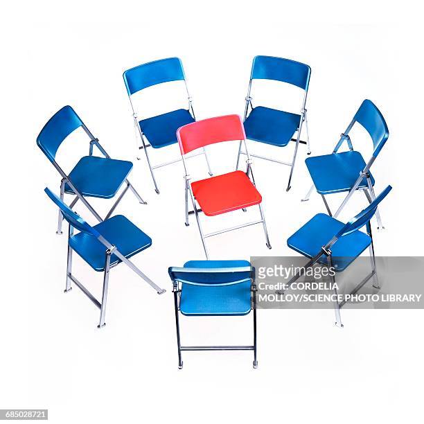 circle of chairs with one in the middle - business relationship stock illustrations