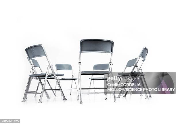 circle of chairs - klappstuhl stock-grafiken, -clipart, -cartoons und -symbole