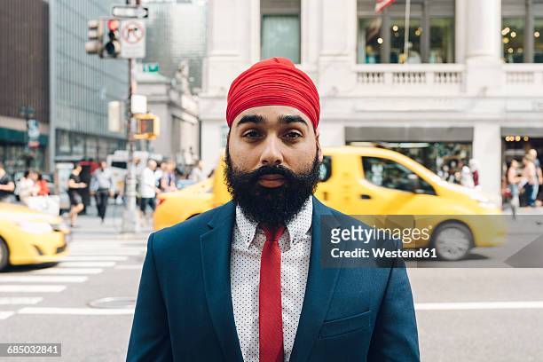 indian businessman crossing street in manhattan - headdress stock pictures, royalty-free photos & images