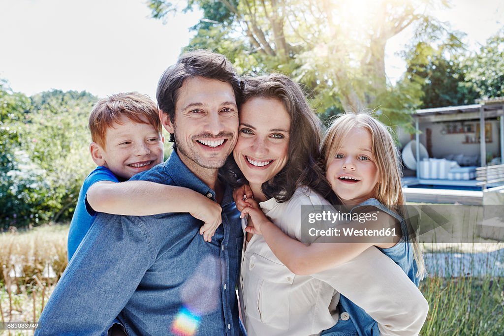Portrait of happy family in garden