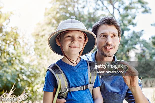 father and son on expedition - pith stock pictures, royalty-free photos & images