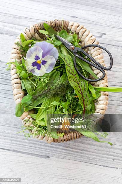 basket of wild herbs and edible flowers - calendula stockfoto's en -beelden