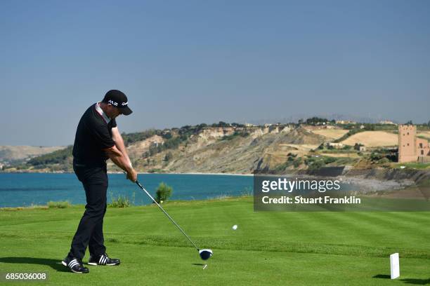 Marcus Fraser of Australia hits his tee shot on the 16th hole during the second round of The Rocco Forte Open at The Verdura Golf and Spa Resort on...