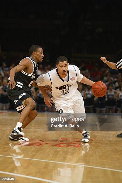 Kevin Braswell of the Georgetown Hoyas drives past John Linehan of the Providence Friars during the first round of the Big East Tournament at Madison...