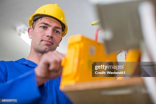 electrician working with voltmeter - voltmeter stock pictures, royalty-free photos & images