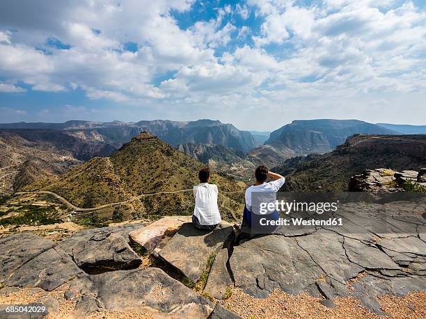 oman, jabal akhdar, two women looking at mountain view - oman landscape stock pictures, royalty-free photos & images