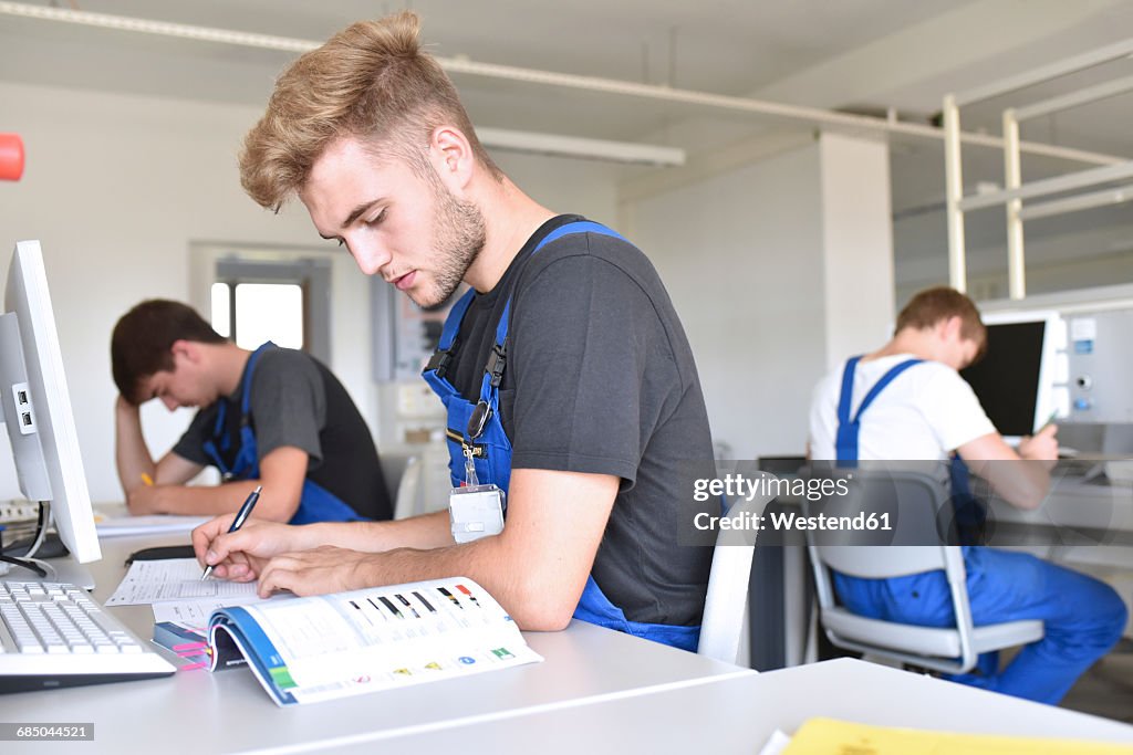Vocational school students writing a test