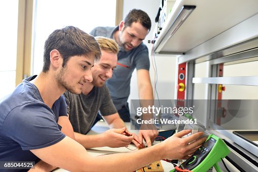 Technical instructor teaching students Technical instructor teaching students