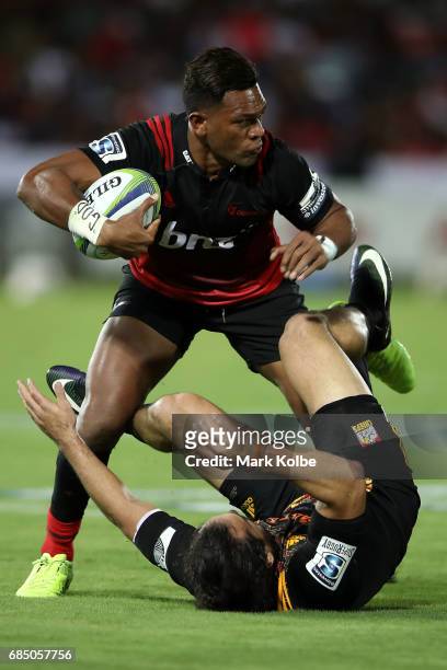 Seta Tamanivalu of the Crusaders is tackled by James Lowe of the Chiefs during the round 13 Super Rugby match between the Chiefs and the Crusaders at...
