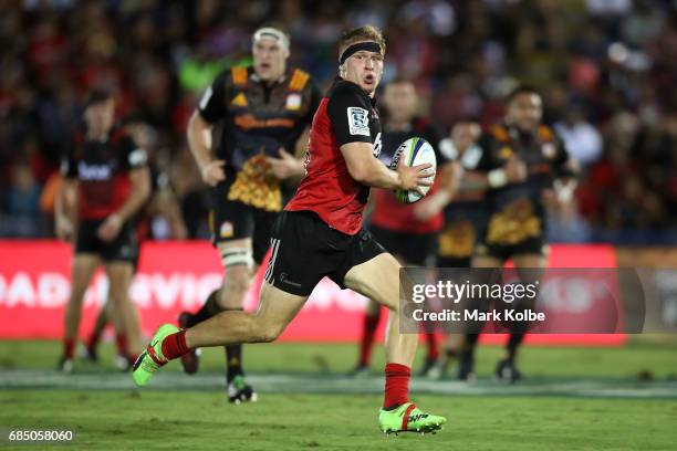 Jack Goodhue of the Crusaders makes a break during the round 13 Super Rugby match between the Chiefs and the Crusaders at ANZ Stadium on May 19, 2017...