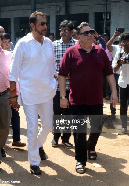 Indian Bollywood actors Kiran Kumar and Rishi Kapoor arrive to attend the funeral of veteran Bollywood Hindi and Marathi film actress Reema Lagoo in...