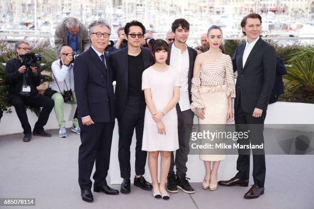 Actors Byung Heebong, Steven Yeun, Ahn Seo-Hyun, Devon Bostick, Lily Collins and Paul Dano attend the "Okja" photocall during the 70th annual Cannes...