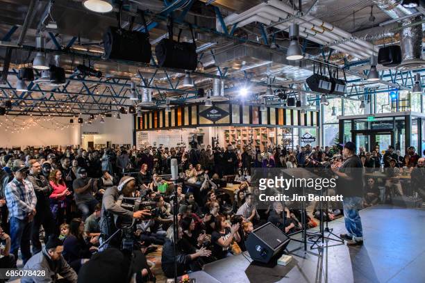 Radio station KEXP's DJ Riz tells stories and talks to the gathered audience at a memorial for Chris Cornell held at the station on May 18, 2017 in...