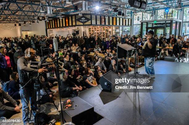 Radio station KEXP's DJ Riz tells stories and talks to the gathered audience at a memorial for Chris Cornell held at the station on May 18, 2017 in...