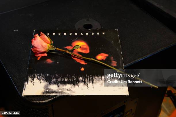 Rose adorns a Soundgarden vinyl record at a memorial held for Chris Cornell at radio station KEXP on May 18, 2017 in Seattle, Washington. Cornell, of...