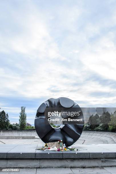Fans create an impromptu memorial to Chris Cornell in front of the Black Sun sculpture in Volunteer Park on May 18, 2017 in Seattle, Washington....
