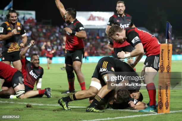 Ben Funnell of the Crusaders dives over to score a try during the round 13 Super Rugby match between the Chiefs and the Crusaders at ANZ Stadium on...