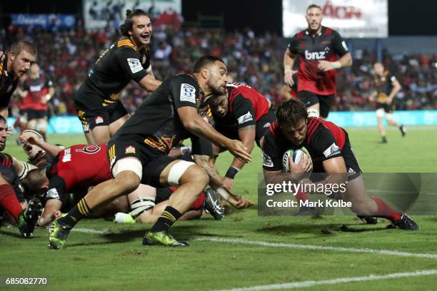 Ben Funnell of the Crusaders dives over to score a try during the round 13 Super Rugby match between the Chiefs and the Crusaders at ANZ Stadium on...