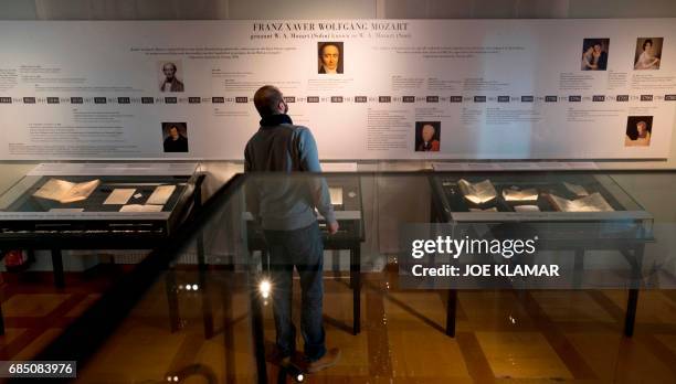 Visitor looks at a chronology of the Austrian musician Franz Xaver Mozart on display at the Mozart Residence in Salzburg, during an exhibition...
