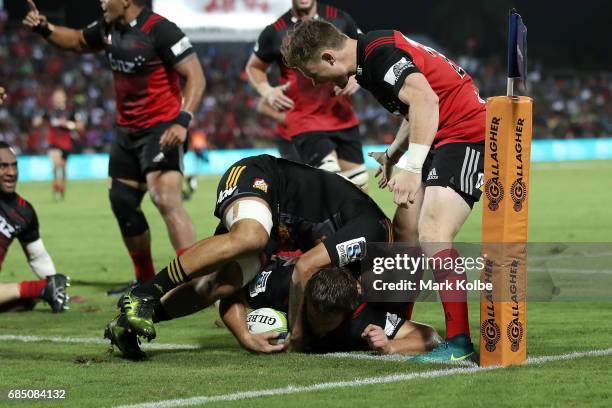 Ben Funnell of the Crusaders dives over to score a try during the round 13 Super Rugby match between the Chiefs and the Crusaders at ANZ Stadium on...
