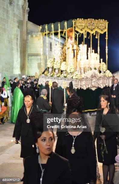 Women with mantilla accompany the image of the Virgin of Hope in the Holy Thursday procession, Easter in Huelma, Jaen, Andalusia, Spain, April 2015.