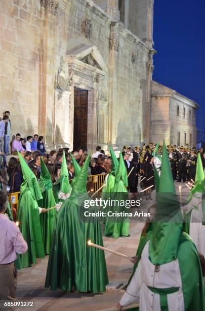 Hooded penitents in the procession of the Holy Thursday, Holy Week in Huelma, Jaen, Andalusia, Spain, April 2015.