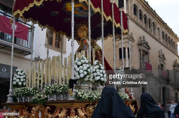 Holy Mary of the Charity after passing the Renaissance Palace of Vela de los Cobo, during the magna procession on Good Friday in Ubeda,Jaen,...