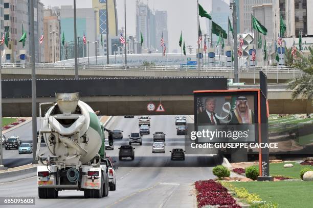 Giant billboard bearing portraits of US President Donald Trump and Saudi Arabia's King Salman, is seen on a main road in Riyadh, on May 19, 2017....