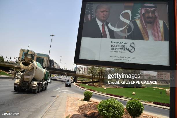 Giant billboard bearing portraits of US President Donald Trump and Saudi Arabia's King Salman, is seen on a main road in Riyadh, on May 19, 2017....