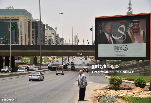 Giant billboard bearing portraits of US President Donald Trump and Saudi Arabia's King Salman, is seen on a main road in Riyadh, on May 19, 2017....