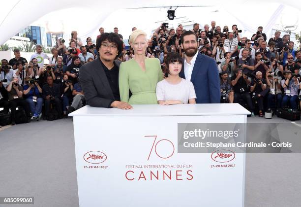 Director Bong Joon-Ho, Tilda Swinton, Ahn Seo-Hyun and Jake Gyllenhaal attend the "Okja" photocall during the 70th annual Cannes Film Festival at...