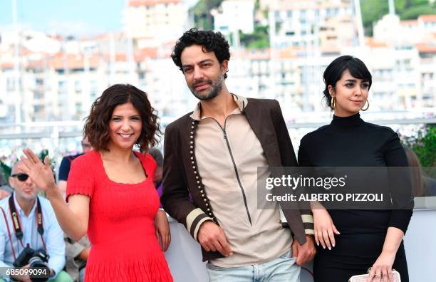 Tunisian director Kaouther Ben Hania, Tunisian actor Ghanem Zrelli and Tunisian actress Mariam Al Ferjani pose on May 19, 2017 during a photocall for...