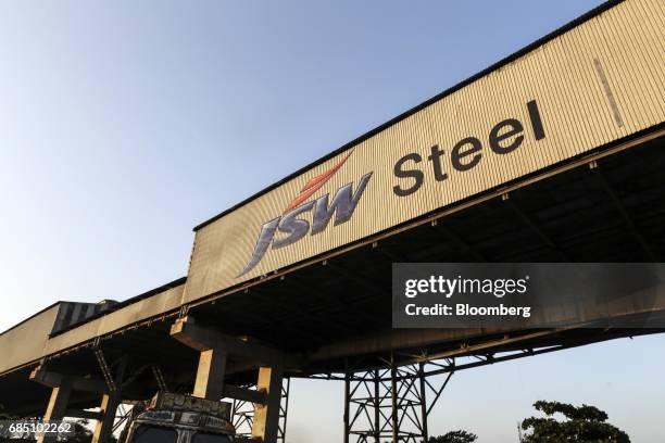 Signage for JSW Steel Ltd. Is seen on the exterior of the company's manufacturing facility in Dolvi, Maharashtra, India, on Thursday, May 18, 2017....