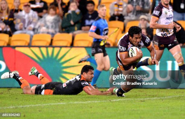 Tautau Moga of the Broncos scores a try during the round 11 NRL match between the Brisbane Broncos and the Wests Tigers at Suncorp Stadium on May 19,...