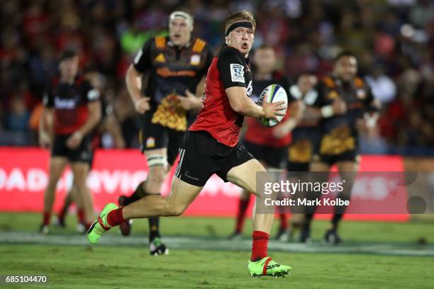 Jack Goodhue of the Crusaders makes a break during the round 13 Super Rugby match between the Chiefs and the Crusaders at ANZ Stadium on May 19, 2017...