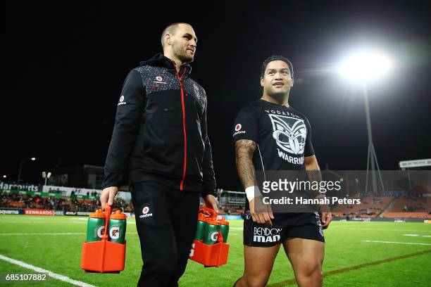 Injured forward Simon Mannering of the Warriors carries the drinks with Issac Luke ahead of the round 11 NRL match between the New Zealand Warriors...