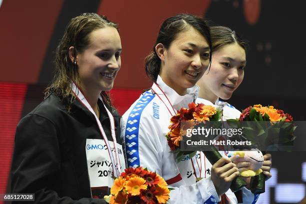 Jessica Hansen of Australia, Satomi Suzuki of Japan and Reona Aoki of Japan pose with their medals on the podium during the Japan Open 2017 at Tokyo...