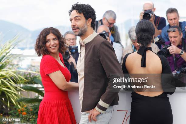 Actors Mariam Al Ferjani, Ghanem Zrelli and director Kaouther Ben Hania attend "Alaka Kaf Ifrit " Photocall during the 70th annual Cannes Film...