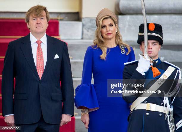 King Willem-Alexander of The Netherlands waits to welcome President Filipe Nyusi of Mozambique and his wife Isaura Nyusi at Palace Noordeinde on May...