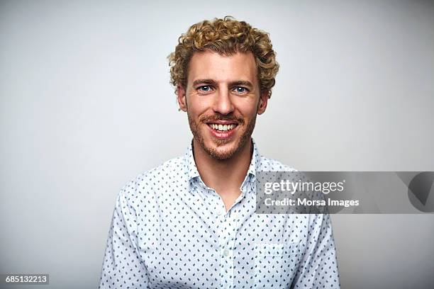 male professional with curly hair over white - blonde man stockfoto's en -beelden