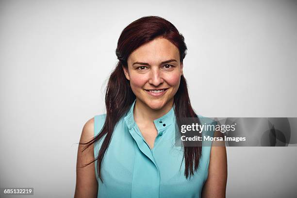 businesswoman smiling over white background - business casual white background stock pictures, royalty-free photos & images