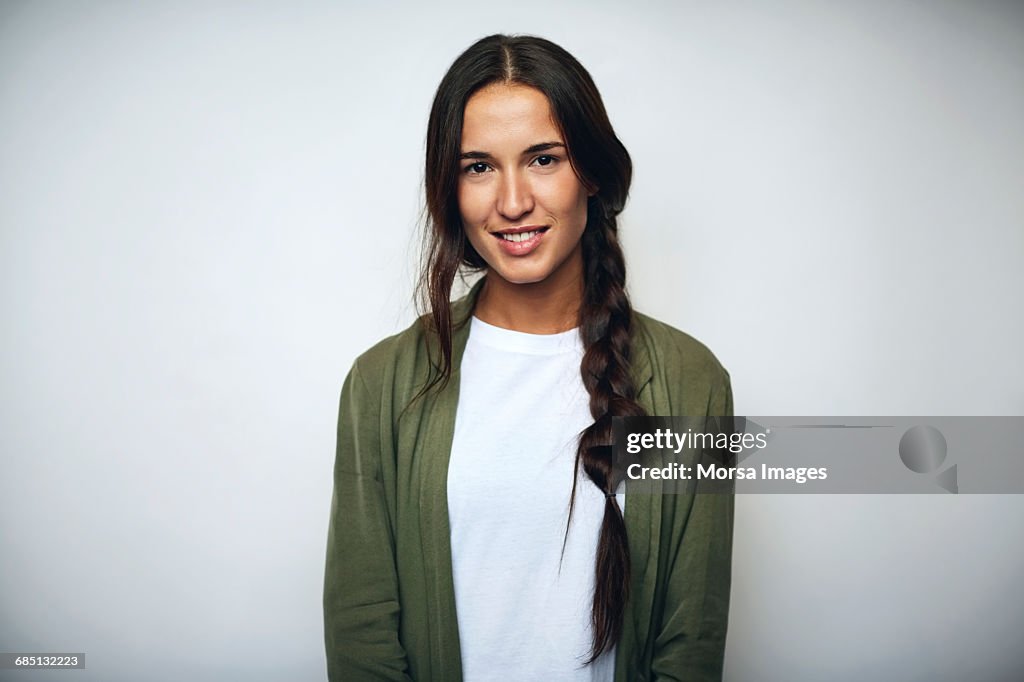 Businesswoman with braided hair over white