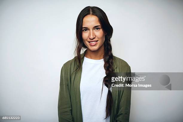 businesswoman with braided hair over white - portrait stock-fotos und bilder
