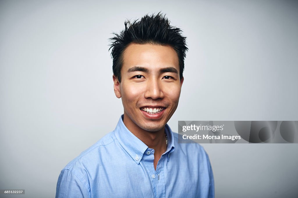 Businessman smiling over white background