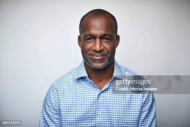 mature businessman smiling over white background - ポートレイト ストックフォトと画像