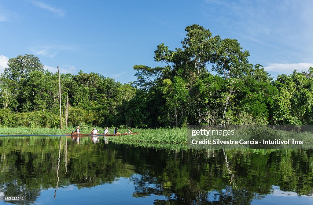 Group of Tourist in canoe in Amazon river