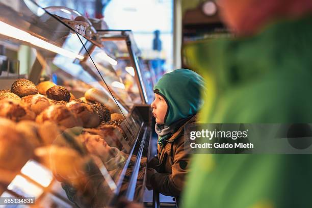 young brothers buying bread. - pasticceria foto e immagini stock