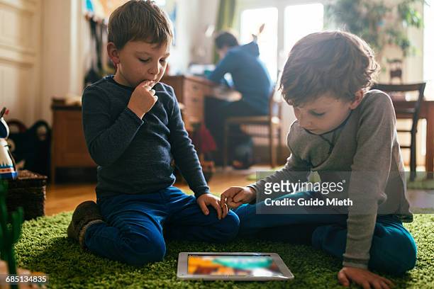 brothers playing together. - sibling stock pictures, royalty-free photos & images