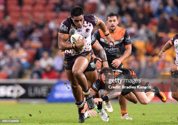 Joe Ofahengaue of the Broncos breaks through the defence during the round 11 NRL match between the Brisbane Broncos and the Wests Tigers at Suncorp...